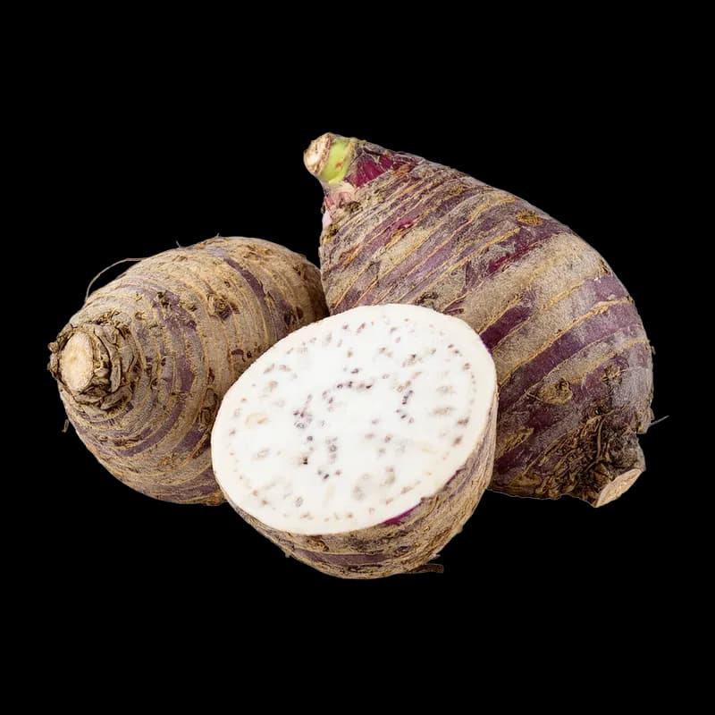 Taro roots with cut taro flesh on a clean white background