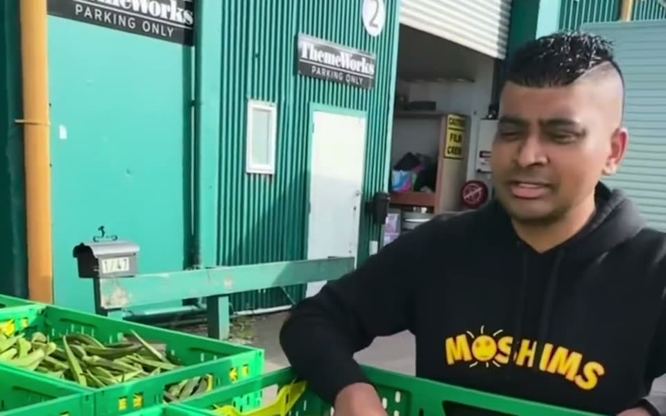 Moshim with crates of produce